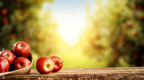 Fotografie Fresh red apples and desk of free space for your decoration.