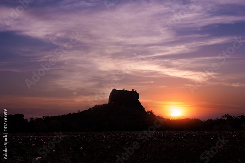 Sunset silhouette of Lion Rock. Sigiriya, Sri Lanka