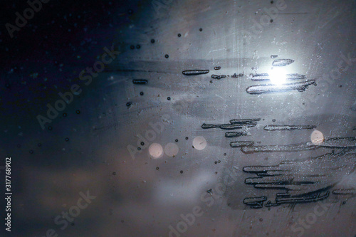 Texture painted with ice on a glass window. Without focus bokeh