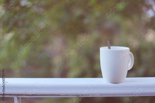 White coffee cup against bl...