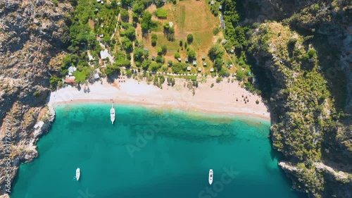 Beautiful bay in the mountains with clear turquoise water. Drone shot