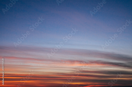 Cloudy sky on sunset with blue and yellow colors