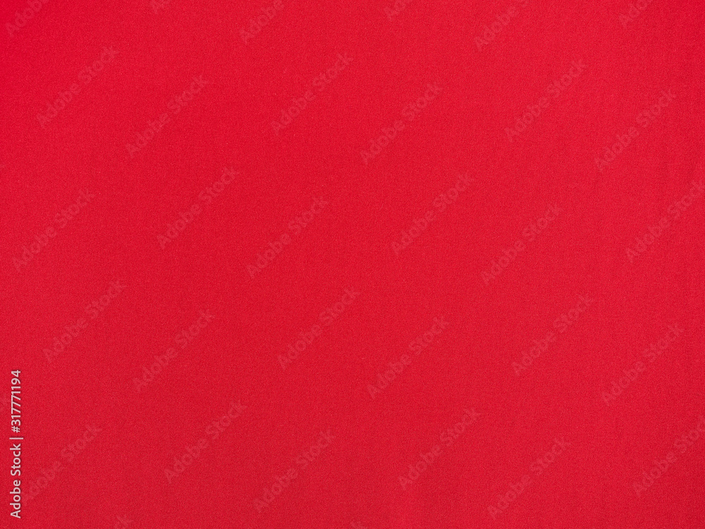 Red fabric made of fine threads, textured surface. top view. Red background. Red fabric made of fine threads, textured surface. top view. Red background.