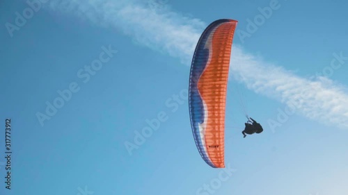 Silhouette Man Paragliding Beautiful Summer Sunset Sky. Paraglide flight experience skydive summer