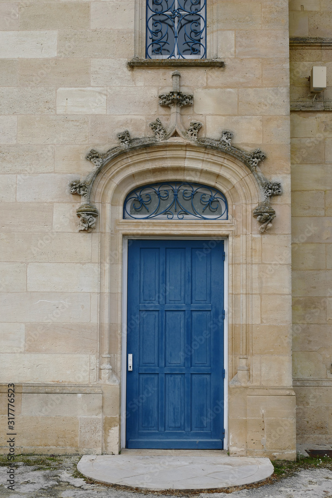 Closeup architectural details of ancient historic castle or chateau in France - door and sculptures