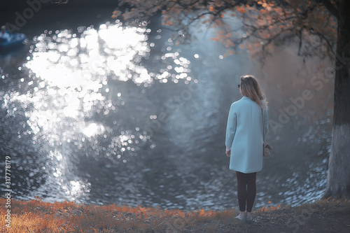 walk in autumn park   beautiful girl in autumn park  model female happiness and fun in yellow trees  October