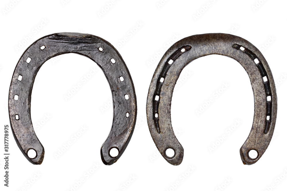 Horseshoe isolated. Close-up of metal horse shoe as a symbol of good luck, prosperity and of a happy future isolated on a white background. Macro photograph. Front and back view. Horseshoe isolated. Close-up of metal horse shoe as a symbol of good luck, prosperity and of a happy future isolated on a white background. Macro photograph. Front and back view.
