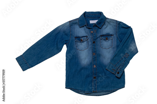 Denim shirts isolated. Close-up of a male stylish faded blue jeans shirt for kids isolated on a white background. Long sleeve shirt summer fashion. © Olga