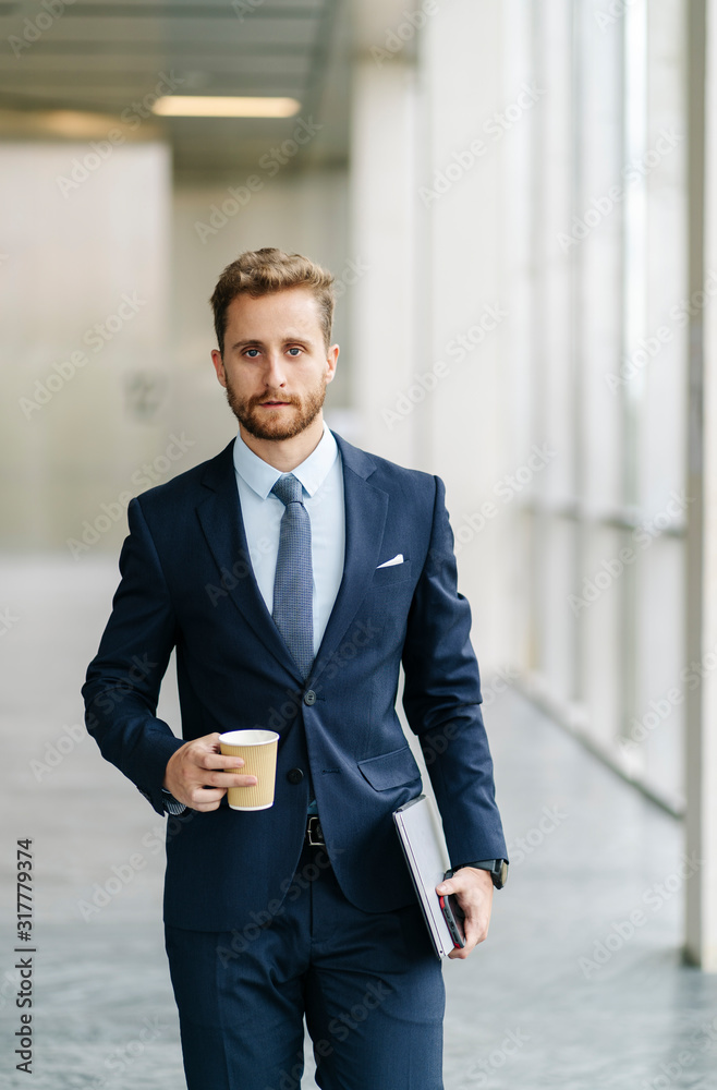 Portrait of businessman holding takeaway coffee Portrait of businessman holding takeaway coffee
