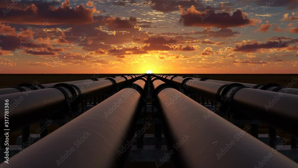 Pipeline transportation of oil, natural gas or water through metal pipes. Concept of the oil refining industry. The camera moves over six pipeline streams right at sunset. 4k Ultra HD 3840x2160