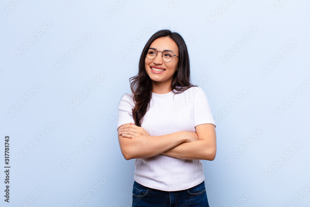 Φωτογραφία young latin pretty woman feeling happy, proud and hopeful, wondering or thinking
