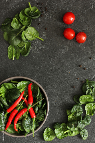 Fresh vegetables and greens on a dark background. Copy space, background image