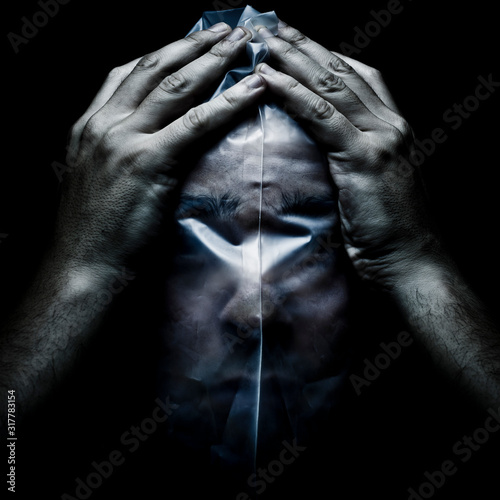 Man with a plastic bag on his face