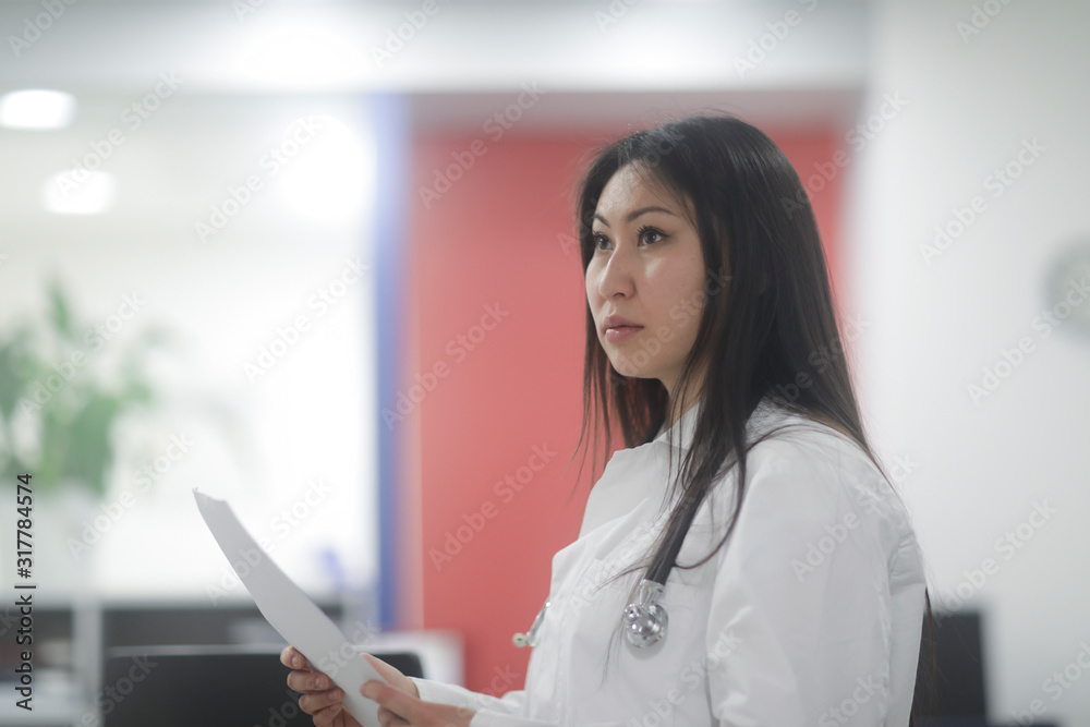 asia woman doctor checking paper in a hospital asia woman doctor checking paper in a hospital
