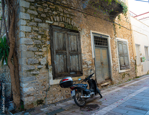 scooter in front of old house