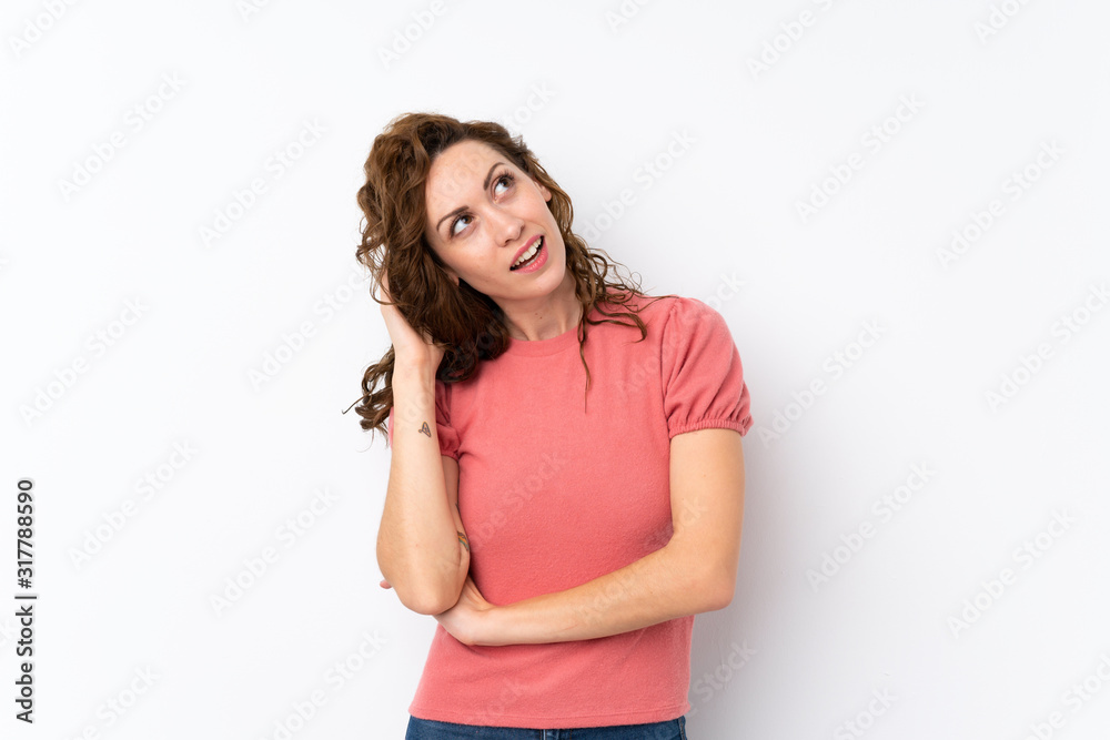 Young pretty woman over isolated background thinking an idea Young pretty woman over isolated background thinking an idea