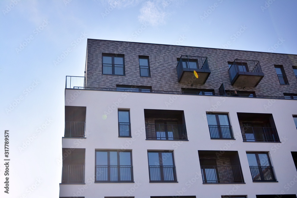 Obraz premium Modern and new apartment building. Multistoried, modern, new and stylish living block of flats.