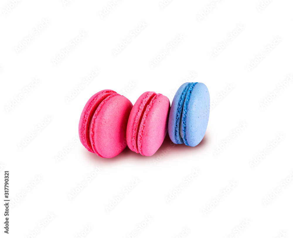 Pink and blue macaroons isolated on a white background. Tasty french cookies Pink and blue macaroons isolated on a white background. Tasty french cookies