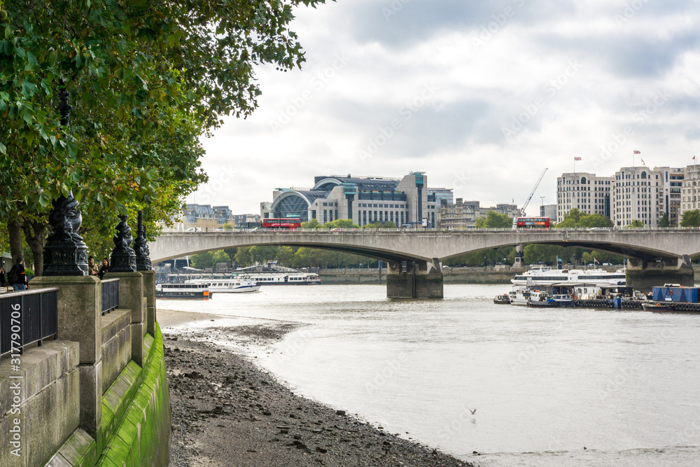 Day time London Waterloo Bridge, Charing Cross railway station, footwalk embankment, car traffic. Day time London Waterloo Bridge, Charing Cross railway station, footwalk embankment, car traffic.