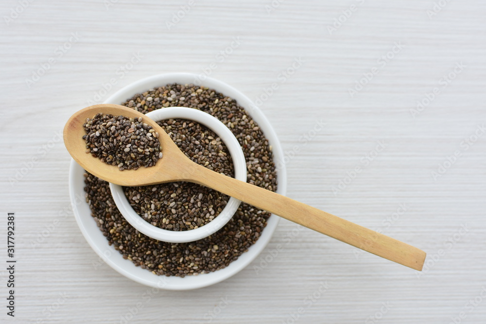 Chia seeds in colorful background Chia seeds in colorful background