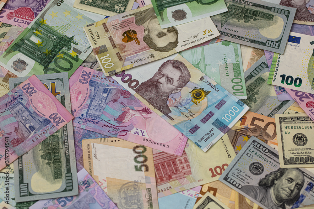 Closeup of dollar, euro and hryvnia banknotes 