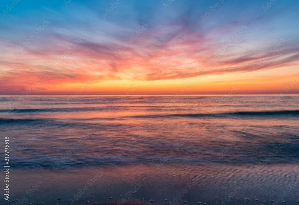 Baltic sea coast at colorful summer sunset Baltic sea coast at colorful summer sunset