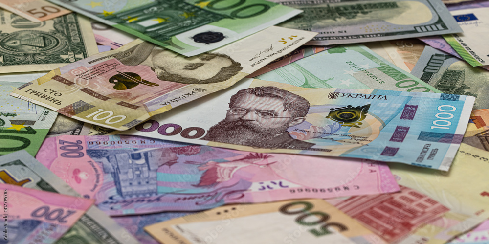 Fototapeta premium Closeup of dollar, euro and hryvnia banknotes 