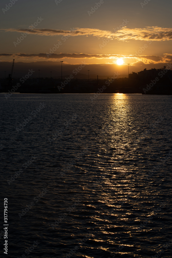 Morning sunrise by the sea with sun light reflecting in waters