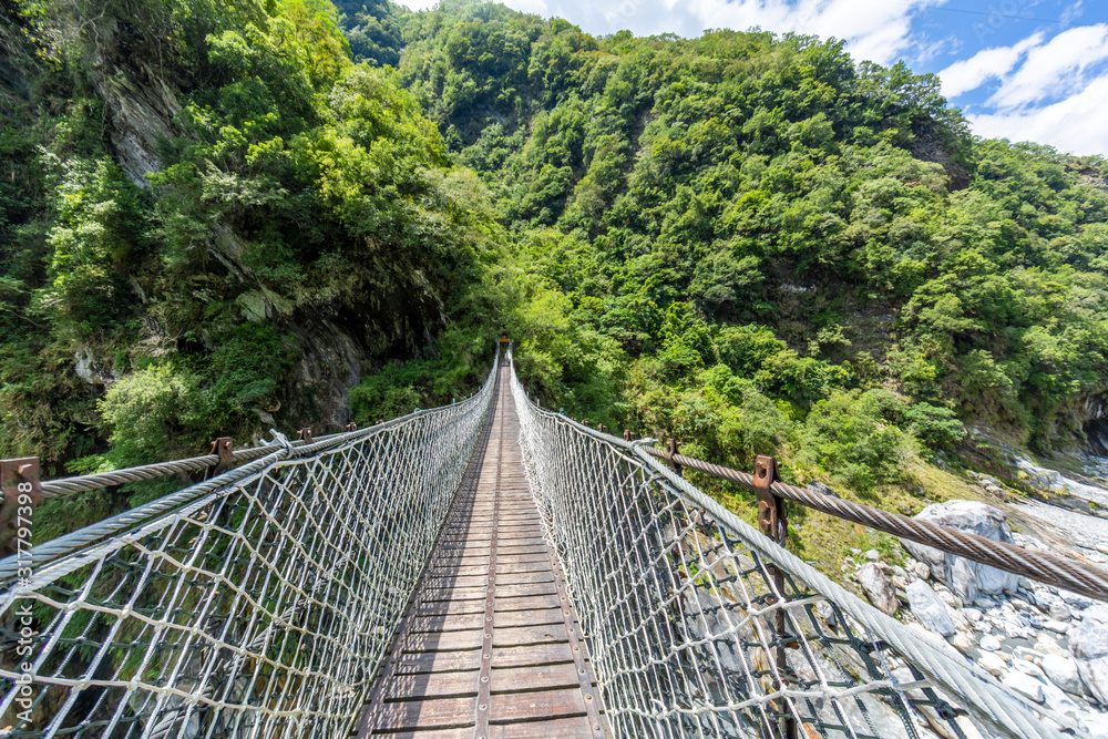 Panoramic view over suspension bridge in the Taroko national park on Taiwan in summer Panoramic view over suspension bridge in the Taroko national park on Taiwan in summer