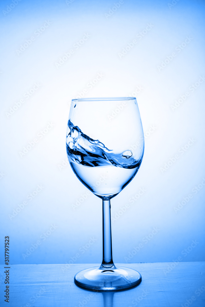 Fototapeta premium Glass with water up and splash
