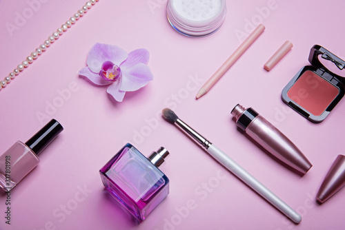 Set of glamorous woman accessories, beauty products and cosmetics on the pink background. Fashion and shopping concept. Pastel colors.