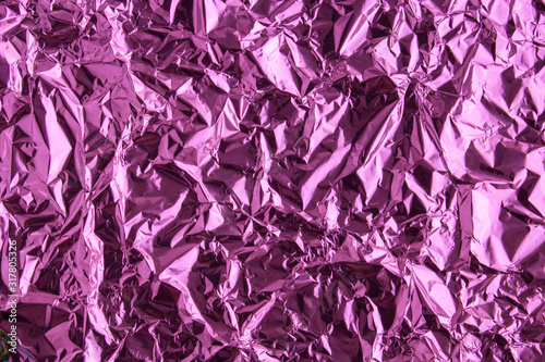 Abstract trendy purple colored crumpled foil texture background. 2020 year color trend concept. © Sofya