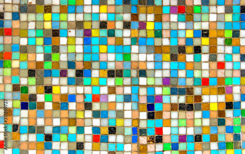 Wall with colorful mosaics background. Multicolor squares look like pixels. background