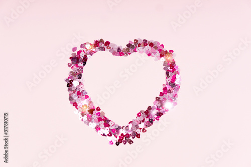 Conffeti hearts on a pink pastel trendy background Valentine's day festive background