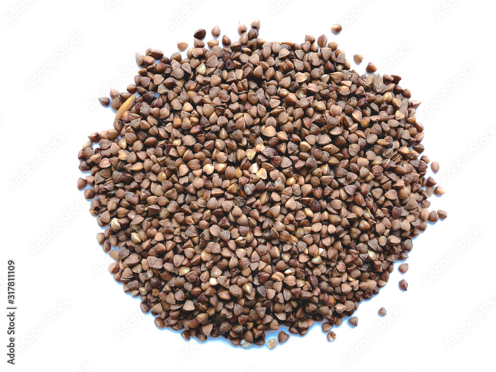 Pile of buckwheat isolated on white background. Top view. Pile of buckwheat isolated on white background. Top view.