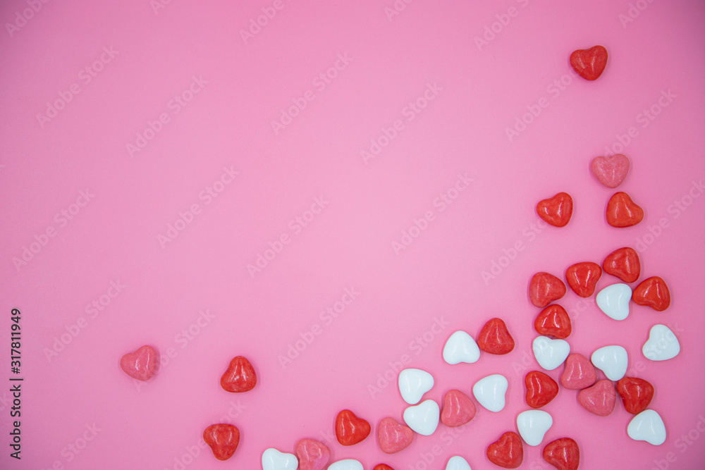 Heart shape candy on pink background. Valentines day concept. 
