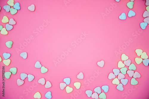 Heart shape message letter candy on pink background. Valentines day concept. 
