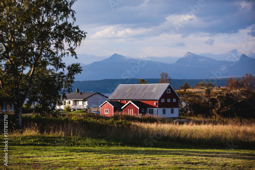 View of Classical Norwegian Camping site with traditional wooden red cottages, Northern Norway