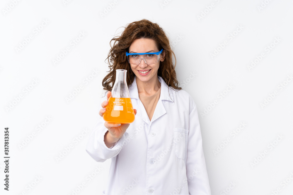 Young pretty woman over isolated background with a scientific test tube Young pretty woman over isolated background with a scientific test tube