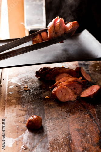 Brazilian barbecue consisting of ground rib, roasted with fruit wood, culinary ingredients, selective focus