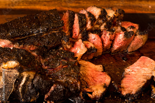 Brazilian barbecue consisting of ground rib, roasted with fruit wood, culinary ingredients, selective focus