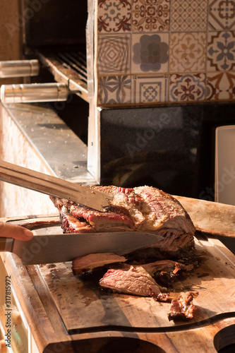 Brazilian barbecue consisting of ground rib, roasted with fruit wood, culinary ingredients, selective focus