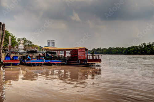 Sampan boats along the Ben Tre river in Vietnam