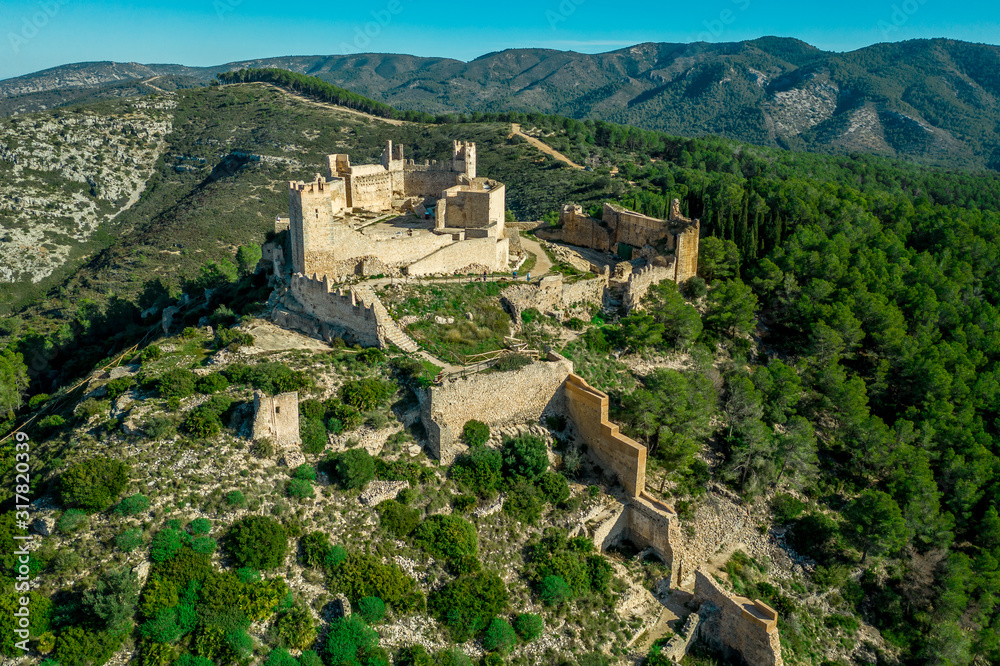 Aerial panorama view of Alcala de Xivert (Alcalá de Chivert) medieval Templar knight castle ruins in Valencia province Spain