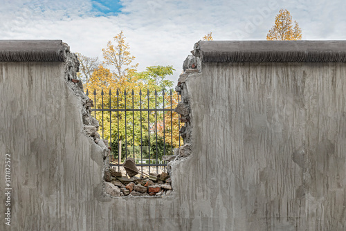 Political barricade that limits freedom. Broken wall that symbolizes freedom