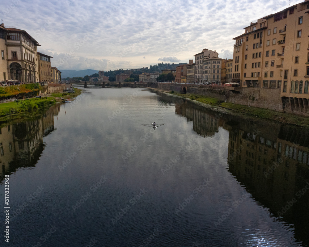 view of river and bridge in florence italy