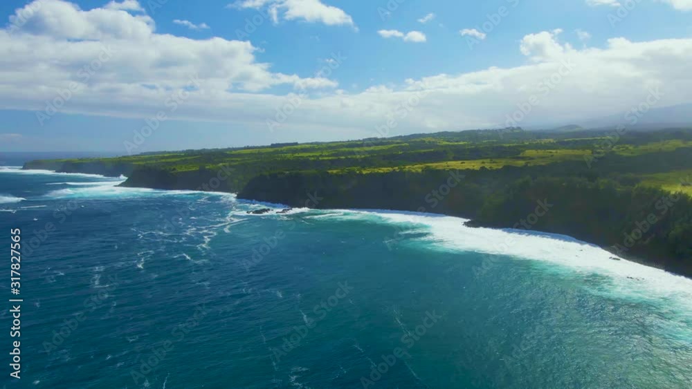 Amazing landscape of tropical islands in Hawaii with green hills rocky coastline crushed by ocean waves Amazing landscape of tropical islands in Hawaii with green hills rocky coastline crushed by ocean waves