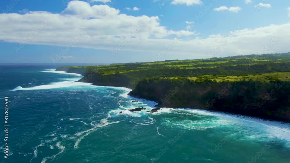 Aerial view of blue turquoise ocean water with white waves splashing and foaming on rocky coastline of Hawaii Aerial view of blue turquoise ocean water with white waves splashing and foaming on rocky coastline of Hawaii