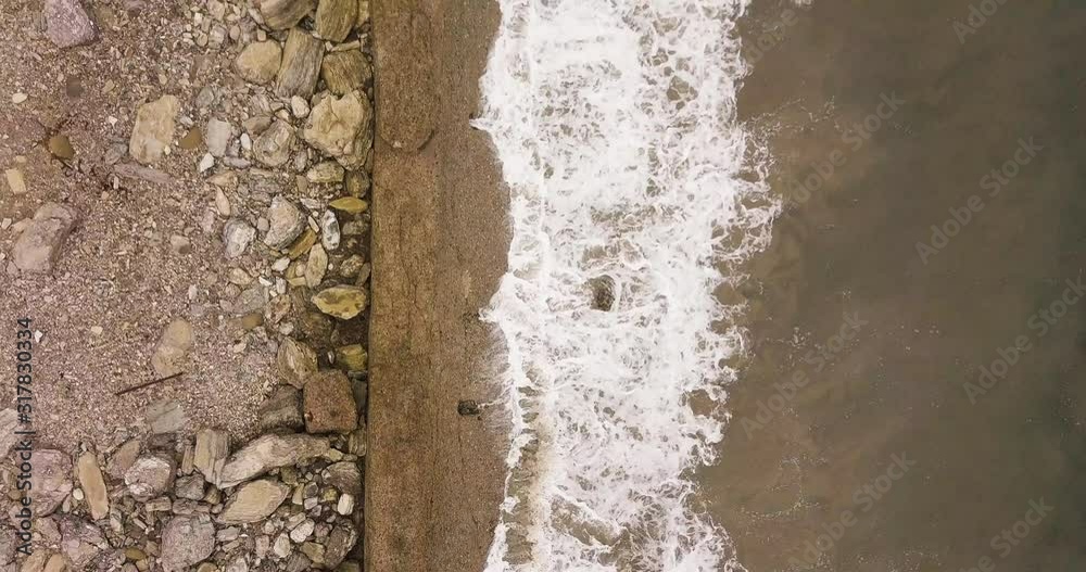 Waves washing rocky California shore. Aerial high angle shot Waves washing rocky California shore. Aerial high angle shot