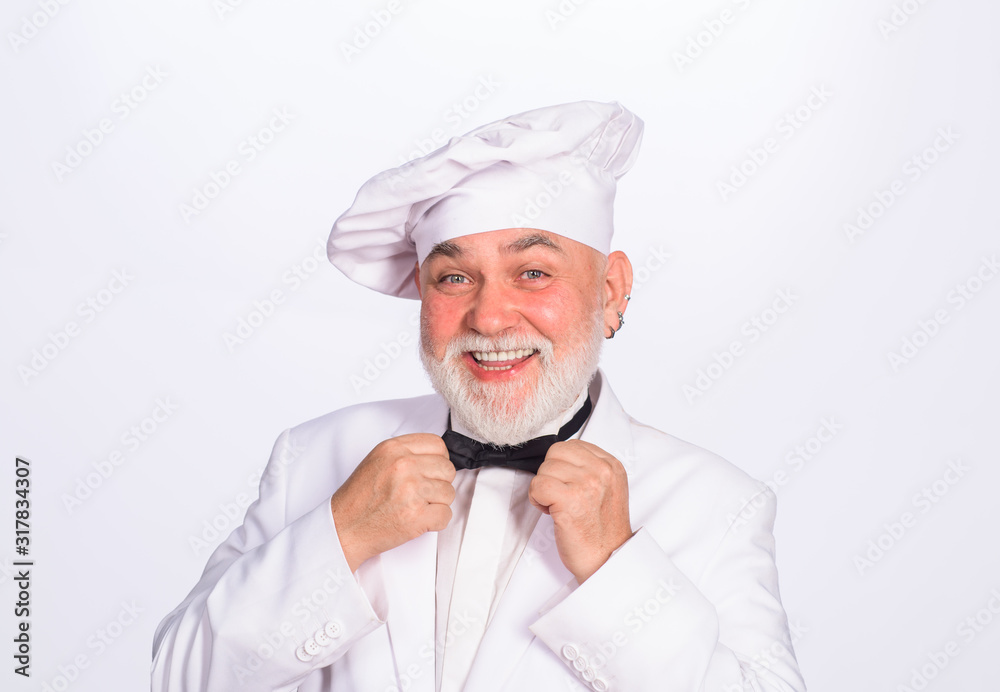 Cooking and food concept. Chief cook and professional culinary. Male chef. Food concept. Bearded chef in uniform, hat and bow tie. Professional chef, cook or baker. Chef man in uniform adjust bow tie. Cooking and food concept. Chief cook and professional culinary. Male chef. Food concept. Bearded chef in uniform, hat and bow tie. Professional chef, cook or baker. Chef man in uniform adjust bow tie.